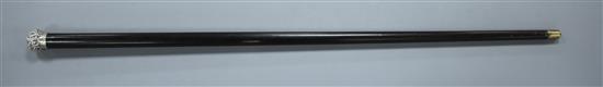 A Victorian walking stick with embossed silver pommel H.M., Birmingham 1906, opens to reveal a compass, overall length 89.5cm